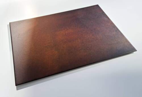 Copper surface with dark patina