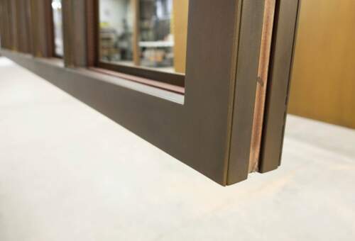 Window frame patinated in bronze